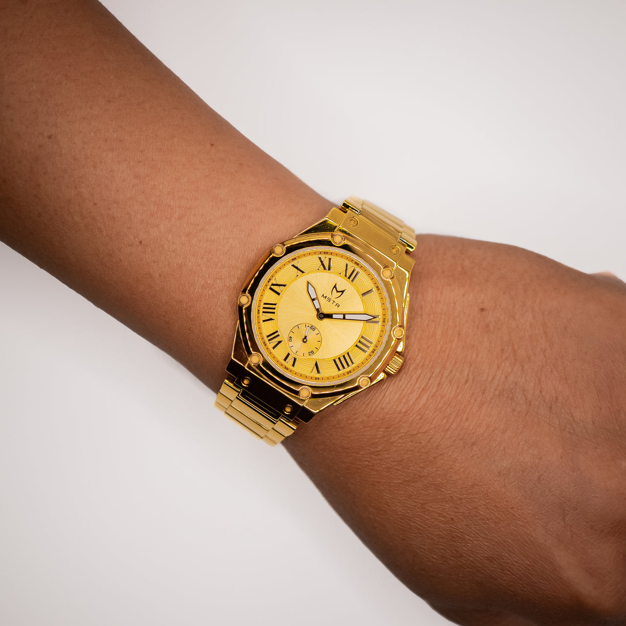 MSTR Ambassador Ultra Slim AU134SS 18k gold watch on models wrist