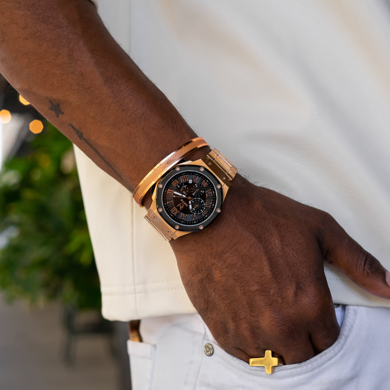 MSTR Ambassador 139SS Rose gold and black watch on models wrist