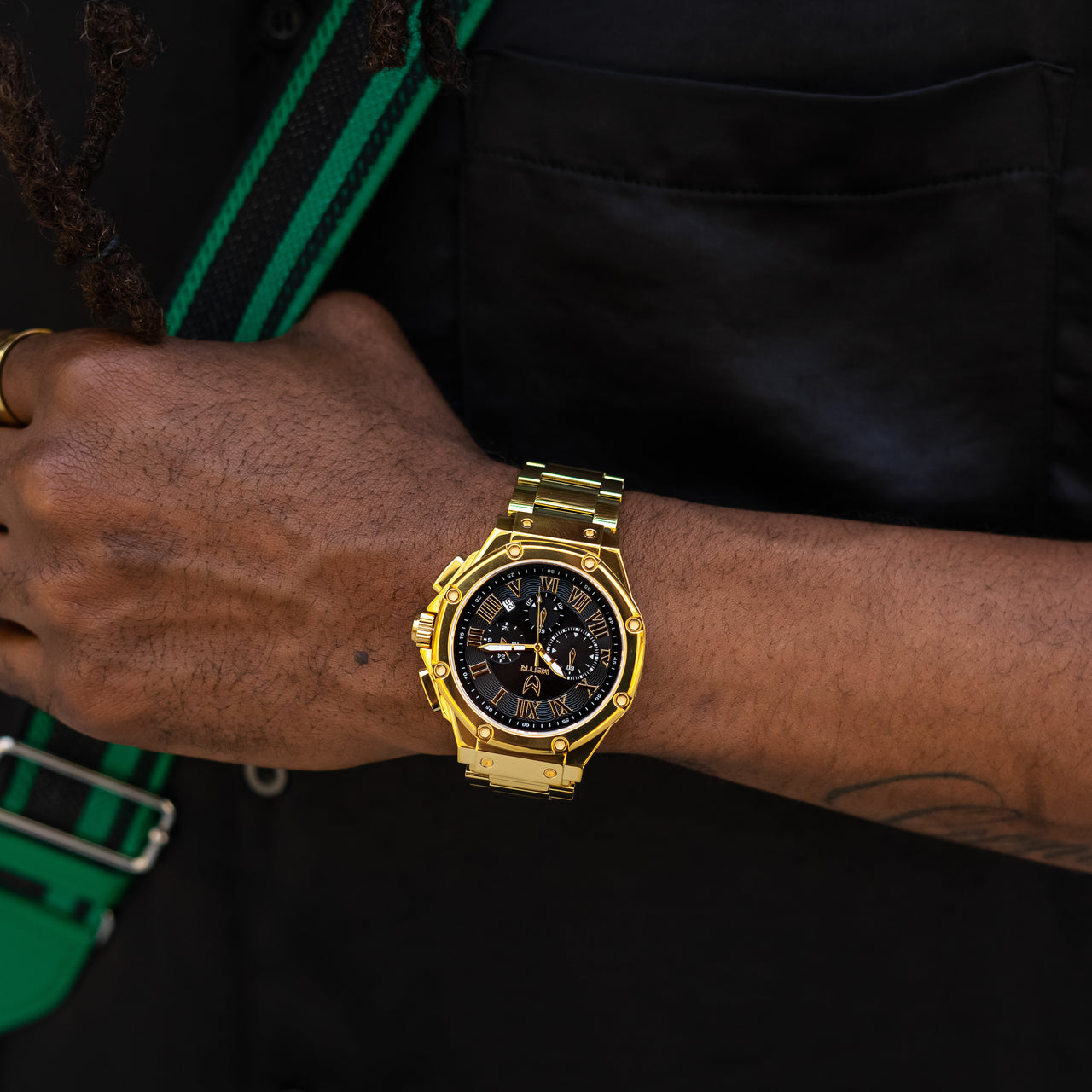 MSTR Ambassador 1001SS gold watch on models wrist