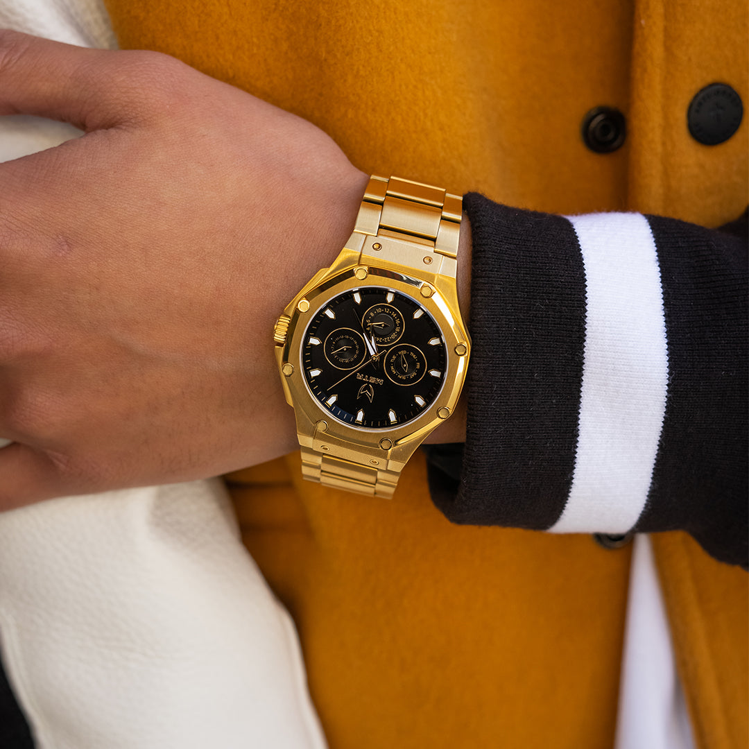 gold watch on wrist