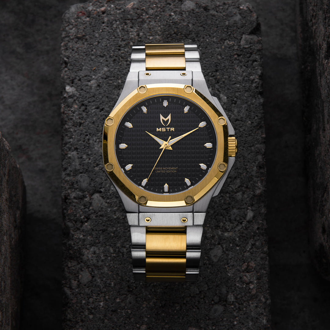 silver and gold watch front shot