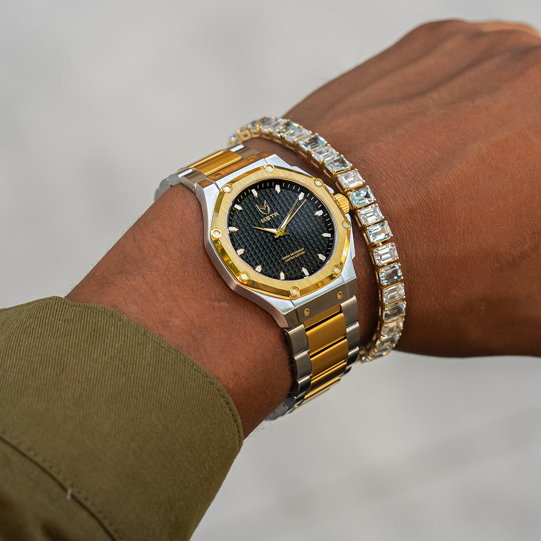 silver and gold watch on wrist
